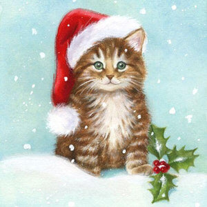 Christmas Cat in winter snow falling